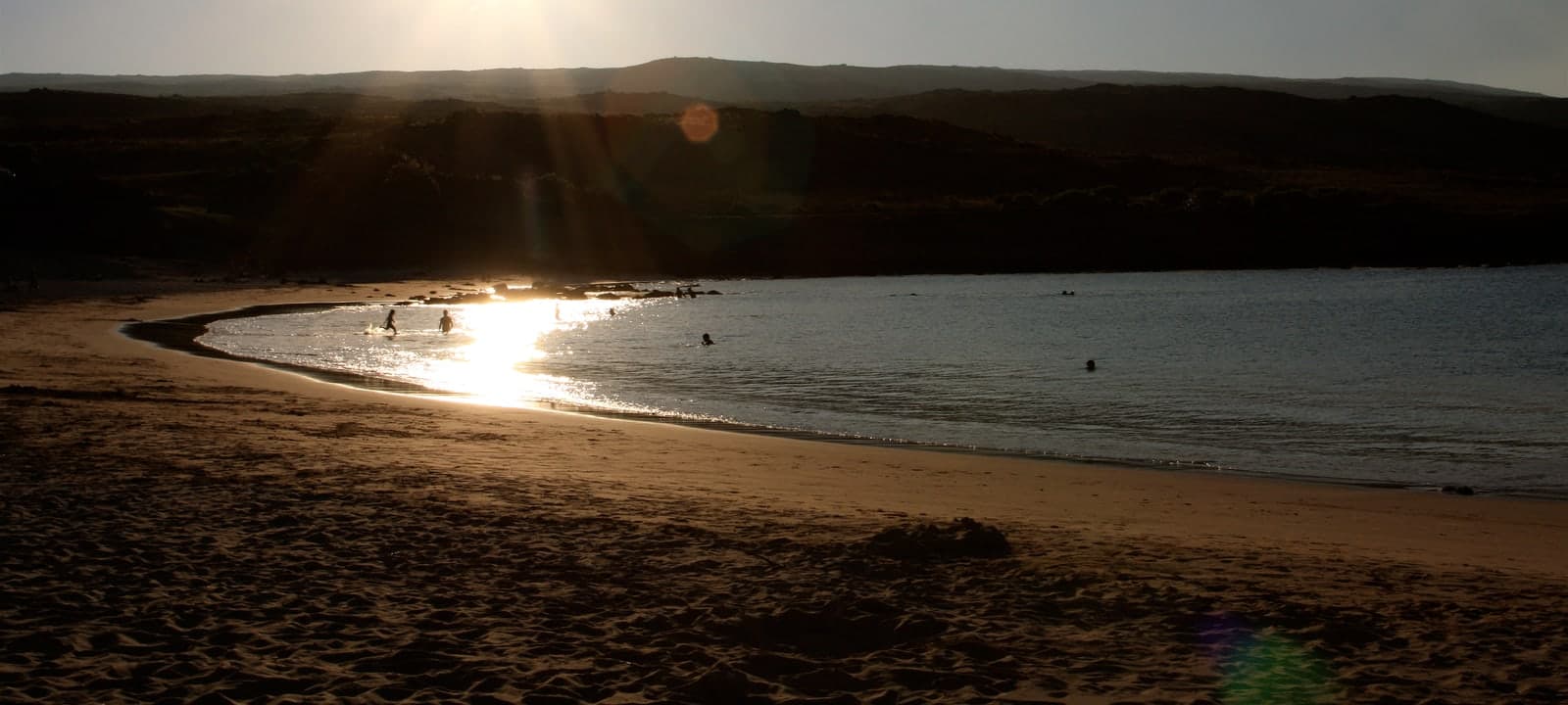 Audience seats facing a lit cinema screen.